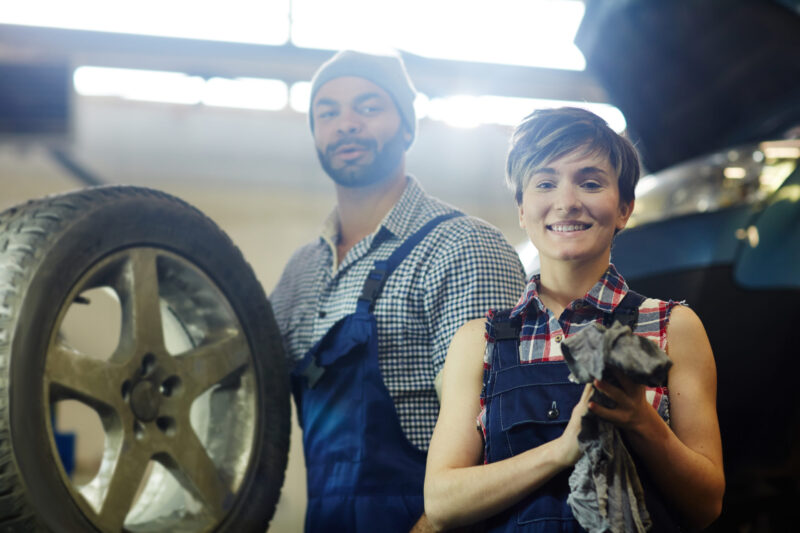 male and female mechanics in bespoke workwear