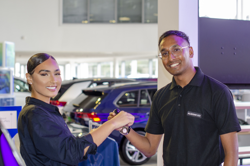 smiling salespeople in automotive dealer brands