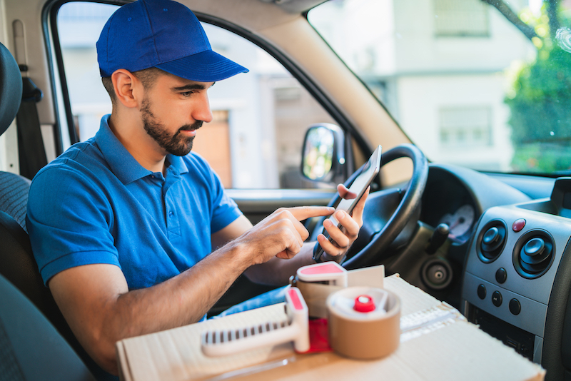 delivery driver in branded driver uniform